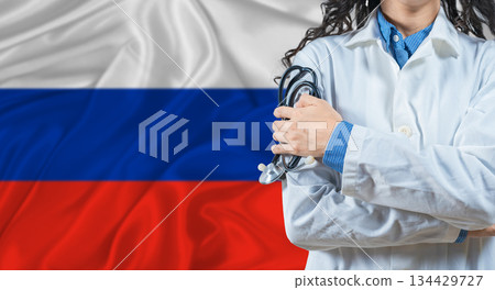 Healthcare professional with Russia flag background. Professional doctor holding stethoscope on Russia flag background Healthcare professional with Russia flag background. Professional doctor holding stethoscope on Russia flag background 134429727