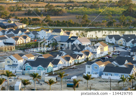 Construction in new developing suburban area. Development of residential housing in American suburbs. Real estate market in the USA Construction in new developing suburban area. Development of residential housing in American suburbs. Real estate market in the USA 134429795