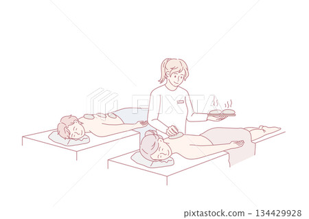 Happy couple enjoy hot stone massage in saloon 134429928