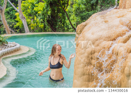 Female tourist exploring Grutas Tolantongo in Mexico, enjoying natural hot springs, scenic caves, and outdoor adventure. Travel, wellness, and sightseeing concept Female tourist exploring Grutas Tolantongo in Mexico, enjoying natural hot springs, scenic caves, and outdoor adventure. Travel, wellness, and sightseeing concept 134430016