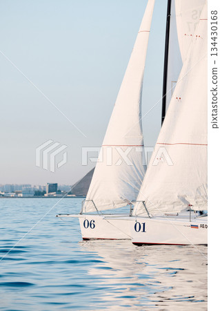 bow of a sailing boats with bowsprit at sailing regatta in the Gulf of Finland at sunny day, sailing yacht competing in a race, splashing water from under the boat, teamwork, board the boat 134430168