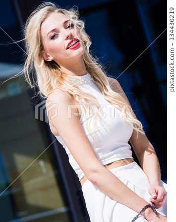 Blonde woman in city 134430219
