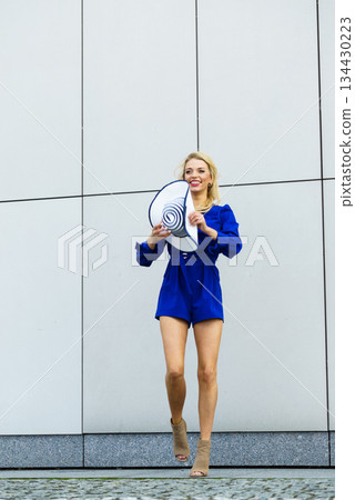 Fashion model throwing hat Fashion model throwing hat 134430223