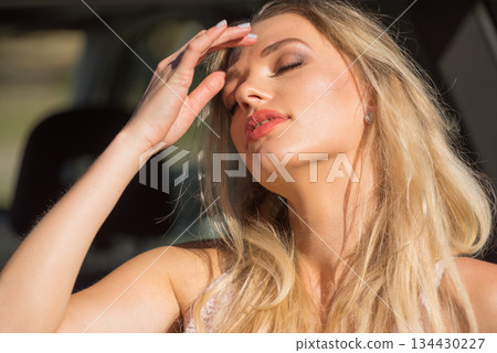 Woman relaxing in car 134430227