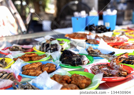 Mediterranean seafood street food platter with fish, shrimp, and crabs. 134430904