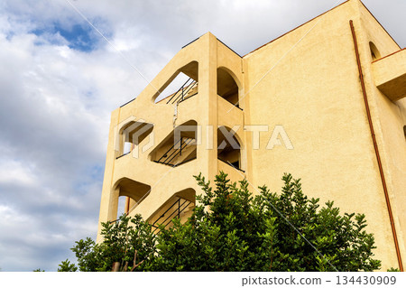 Yellow Residential Building with Summer Blue Sky. Yellow Residential Building with Summer Blue Sky. 134430909