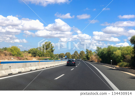 Open road in Sicily under blue sky 134430914
