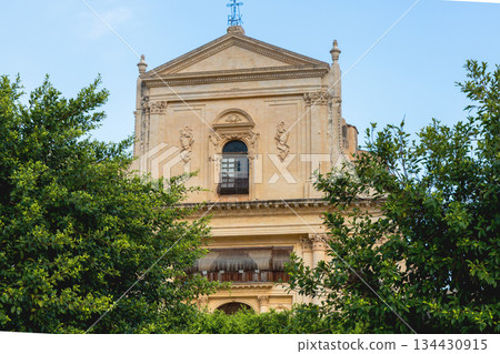 historic catholic church facade under bright blue sky historic catholic church facade under bright blue sky 134430915