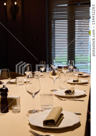 bright daytime dining scene featuring sophisticated table decoration and professional service bright daytime dining scene featuring sophisticated table decoration and professional service 134432263