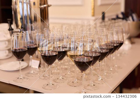 Sophisticated Service Area With Pristine Stemware And Bustling Staff Preparing For Celebration Sophisticated Service Area With Pristine Stemware And Bustling Staff Preparing For Celebration 134432306