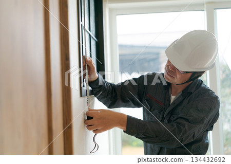 A man in his 50s wearing work clothes 134432692