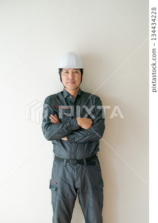 A man wearing a helmet A man wearing a helmet 134434228