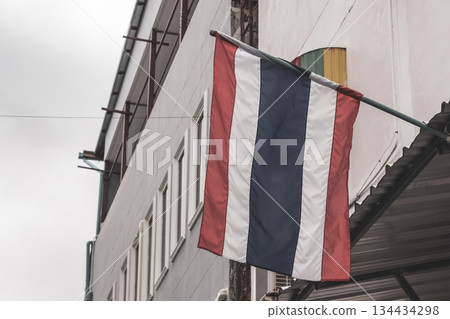 Thailand Thai flag blowing in the wind in the city. Thailand Thai flag blowing in the wind in the city. 134434298