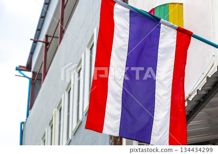 Thailand Thai flag blowing in the wind in the city. Thailand Thai flag blowing in the wind in the city. 134434299