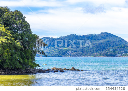Patong Beach Phuket with promenade boats turquoise blue water Thailand. Patong Beach Phuket with promenade boats turquoise blue water Thailand. 134434328