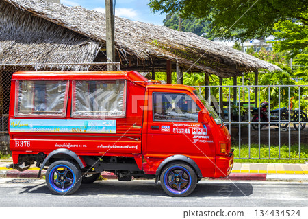 Red public transportation tuk tuk car taxi in Phuket Thailand. Red public transportation tuk tuk car taxi in Phuket Thailand. 134434524