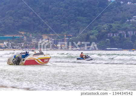 Speed boat yacht and jetski blue water Patong Beach Thailand. Speed boat yacht and jetski blue water Patong Beach Thailand. 134434542