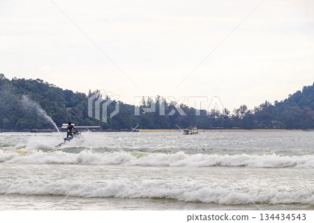 Jet ski jetski and turquoise blue water Patong Beach Thailand. Jet ski jetski and turquoise blue water Patong Beach Thailand. 134434543