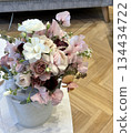 An elegant and gentle natural bouquet of white and pink on the table 134434722