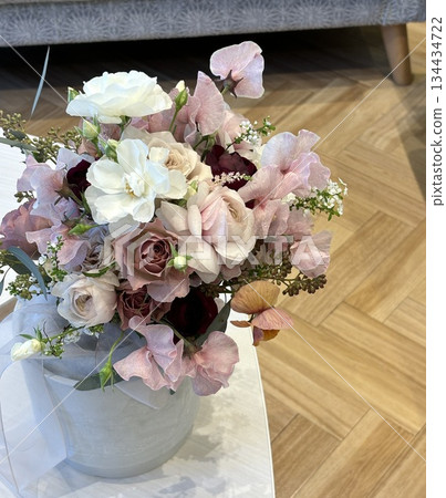 An elegant and gentle natural bouquet of white and pink on the table 134434722