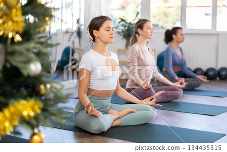 Group of women doing yoga in studio 134435515