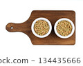 Green lentils in wooden bowl on isolated white background. Top view, copy space. Flat lay. 134435666