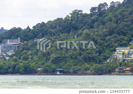Patong Beach Phuket with turquoise blue water and mountains Thailand. Patong Beach Phuket with turquoise blue water and mountains Thailand. 134435777