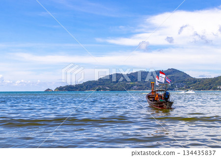 Longtail boat long tail boats at the Patong Beach Thailand. 134435837