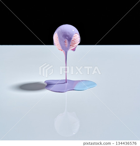 Creative exploration with colored liquid on a surface under controlled lighting at a studio 134436576