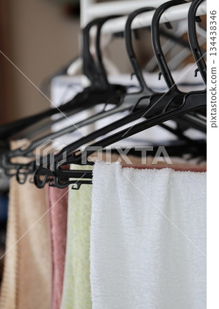 Several face towels hanging to dry indoors Several face towels hanging to dry indoors 134438346