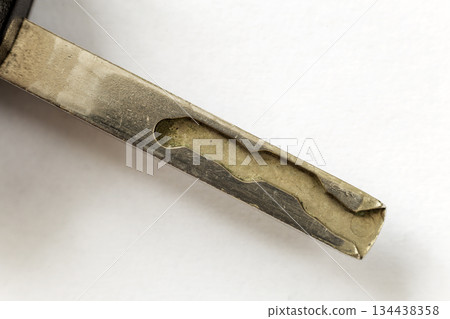 Close-up of car key detail on white copy space background. Vehicle lock and keys design, security and transportation concept. Close-up of car key detail on white copy space background. Vehicle lock and keys design, security and transportation concept. 134438358
