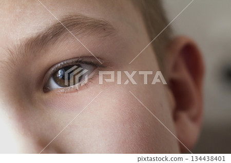 Close up macro of child boy eye 134438401
