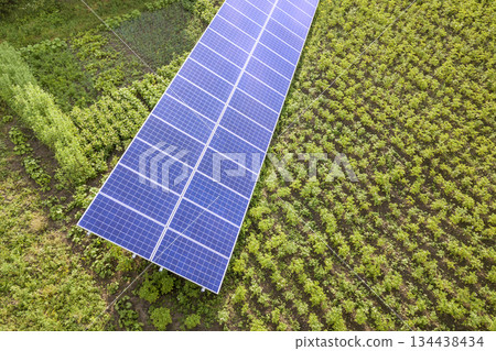 Blue solar panels for clean energy on green grass. Blue solar panels for clean energy on green grass. 134438434