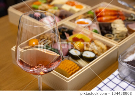 Glass of red wine and New Year's dishes 134438908