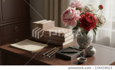 Chinese Thread-Bound Notebook on Wooden Desk with Peony Vase, Brush, and Inkstone 134439023