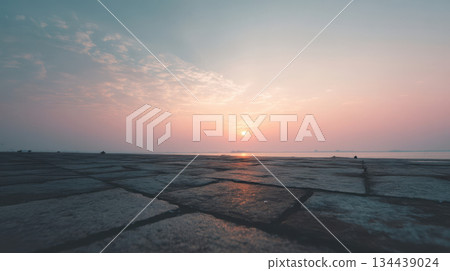 A nearly empty stone embankment at dawn over a calm river, a minimalist landscape with a soft pastel sky and a serene atmosphere A nearly empty stone embankment at dawn over a calm river, a minimalist landscape with a soft pastel sky and a serene atmosphere 134439024