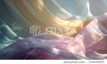 Delicate pastel silk waves in soft sunlight, translucent layers of fabric in dreamy blue, pink and gold tones 134439055