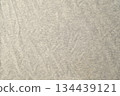High-resolution.Top view of a light gray heathered fabric, likely a jersey knit used for t-shirts or activewear. 134439121