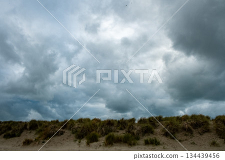 Foreboding weather change, Gloomy clouds gather above breezy Foreboding weather change, Gloomy clouds gather above breezy 134439456