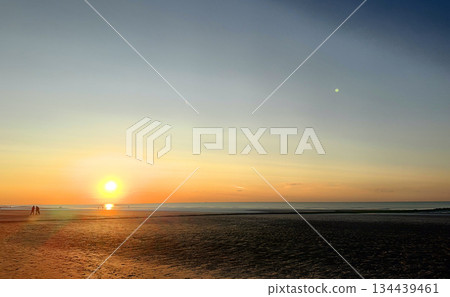 Breathtaking Views of a Stunning Sunset Over a Tranquil Beach Accompanied by Gentle Waves Breathtaking Views of a Stunning Sunset Over a Tranquil Beach Accompanied by Gentle Waves 134439461