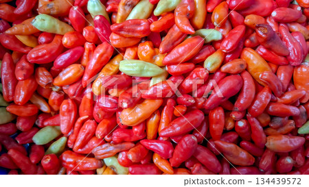 Fresh Mixed Chili Peppers Background Top View Fresh Mixed Chili Peppers Background Top View 134439572