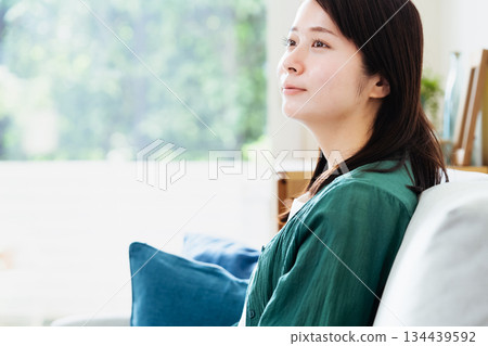 Young woman relaxing in the living room 134439592
