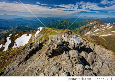 View of the Joetsu border ridge and Mt. Asama and Mt. Akagi from Toma-no-Mimi on Mt. Tanigawa View of the Joetsu border ridge and Mt. Asama and Mt. Akagi from Toma-no-Mimi on Mt. Tanigawa 134439721