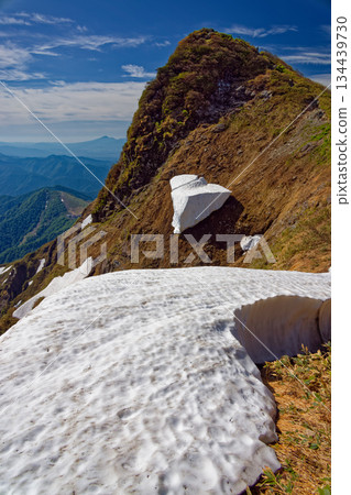 Remaining snow and Mt. Tanigawa and Toma no Mimi Remaining snow and Mt. Tanigawa and Toma no Mimi 134439730