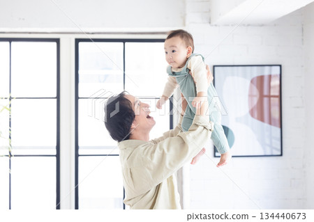 Boy playing with father Boy playing with father 134440673