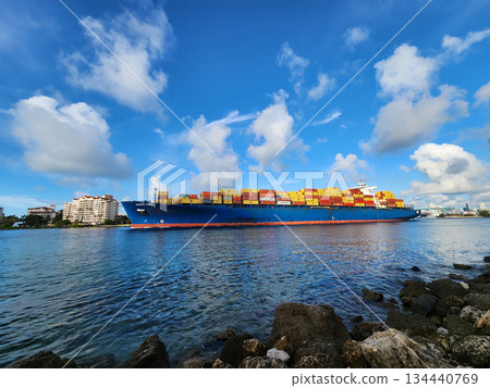 Miami, Florida, USA - June 06, 2024: Freight container on cargo vessel. Maersk Puelo. Cargo ship vessel leaving port. Container ship. Export and import. Cargo ship services with container in Miami Miami, Florida, USA - June 06, 2024: Freight container on cargo vessel. Maersk Puelo. Cargo ship vessel leaving port. Container ship. Export and import. Cargo ship services with container in Miami 134440769