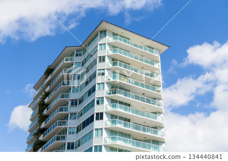 Apartment building with detail. View of building. Residential building architecture. Architectural exterior detail. Residential house exterior fragment. Modern apartment building. Hire rise apartment Apartment building with detail. View of building. Residential building architecture. Architectural exterior detail. Residential house exterior fragment. Modern apartment building. Hire rise apartment 134440841