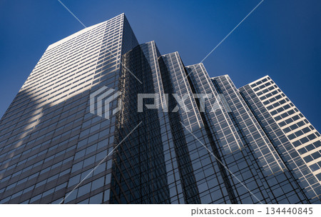 Skyscraper building architecture. Skyscraper with glassy facade. Modern city perspective. Skyscraper in metropolis city. City downtown with skyscraper in perspective. Perspective view 134440845