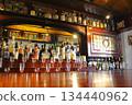 A bar counter lined with alcoholic drinks at the British House in Kobe Ijinkan 134440962