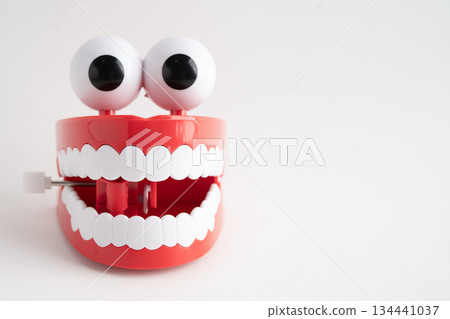 Funny red teeth with eye toy denture model for dental health care. Funny red teeth with eye toy denture model for dental health care. 134441037